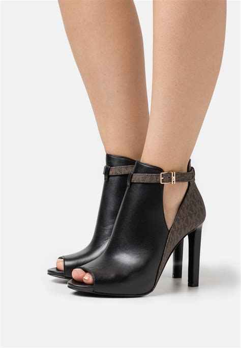 michael kors high hell shoes|Michael Kors heeled boots.